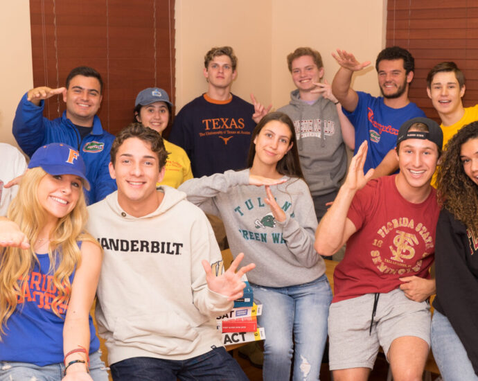 students wearing shirts from their favorite colleges