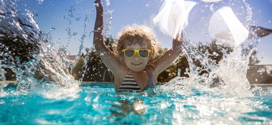 Child splashing in pool