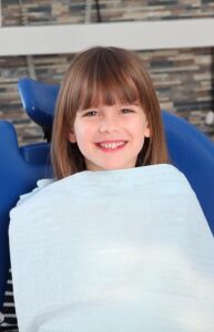 Young girl in dentist chair