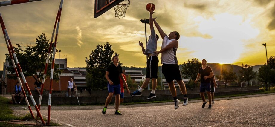 Group of young men playing basketball